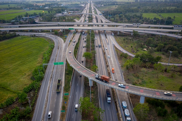 Aerial view interchange freeway overpasses and motorway ring road connecting in the city transportation logistics concept in Thailand 