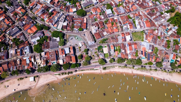 Aerial view of Itacare beach Bahia Brazil Village with fishing boats and vegetation