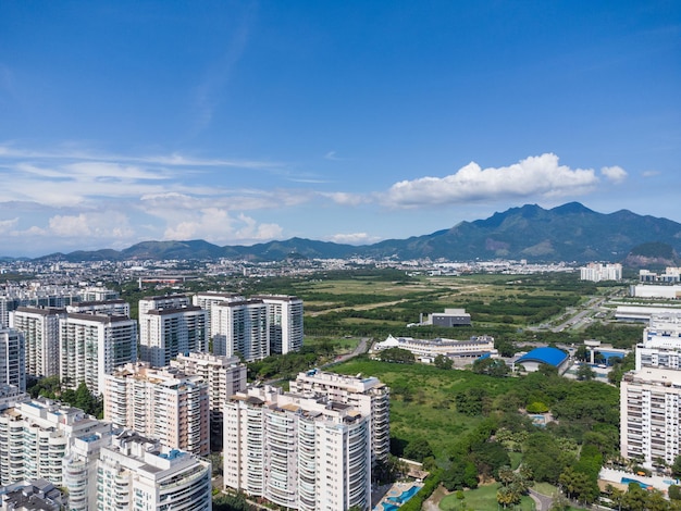 Aerial view of JacarÃÂ©pagua in Rio de Janeiro, Brazil. Residential buildings and mountains in the background. Sunny day. Drone photo.