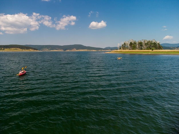 Aerial view of kayak on the lake in mountains