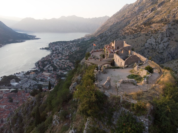 aerial view of kotor bay with kotor city on sunset