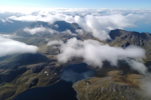 Aerial view of lake surrounded by mountains with clouds floating overhead created with generative ai