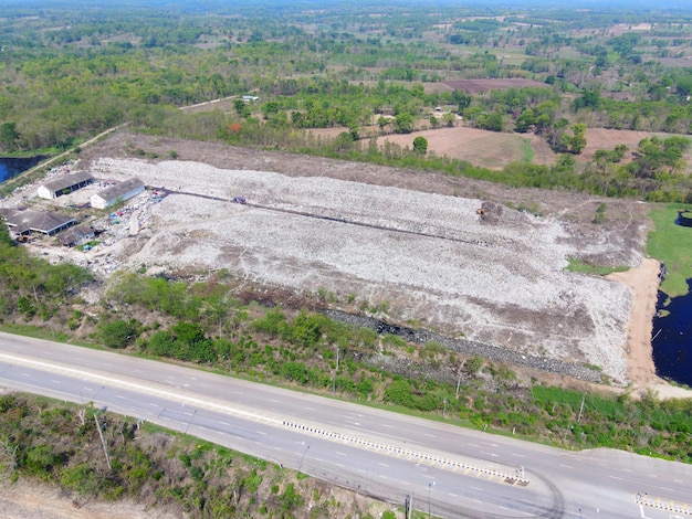 Aerial view landfill garbage waste huge dump environmental pollution problem Top view on plastic and other industrial waste ecological disaster from above with garbage sorting garbage disposal