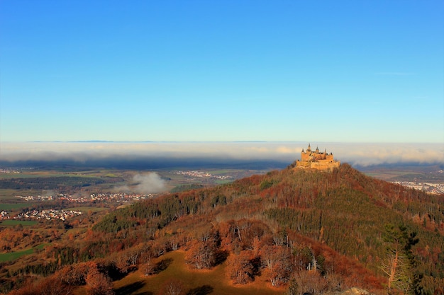 Aerial view of landscape against clear blue sky