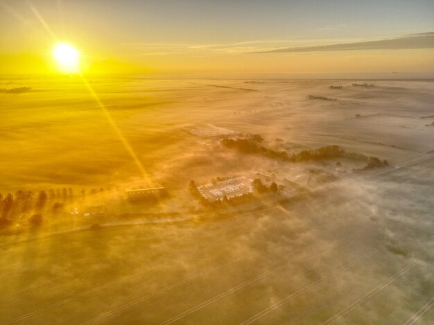 Aerial view of landscape against sky during sunset