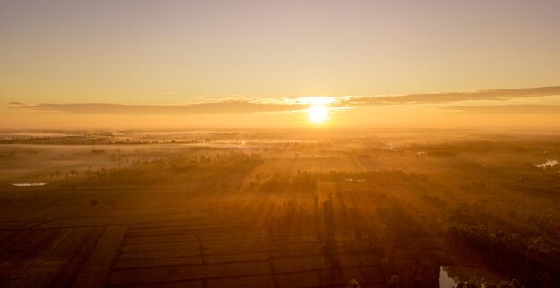 Photo aerial view of landscape during sunset