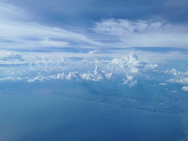 Aerial view of landscape and sea against sky