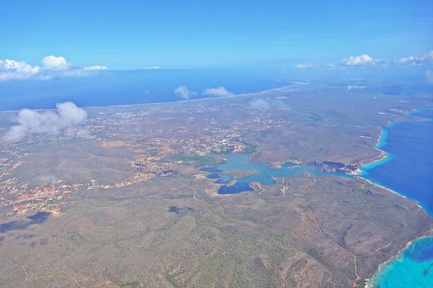 Aerial view of landscape and sea against sky