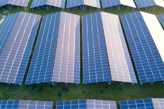 Aerial view of large sustainable electrical power plant with
rows of solar photovoltaic panels for producing clean ecological
electric energy renewable electricity with zero emission
concept