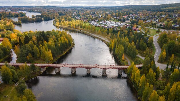 Aerial view of the Lejonstromsbron wooden bridge in Skelleftea Sweden crossing the Skellefte River