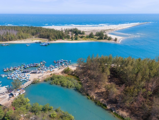 Aerial view of Loc An fishing village Vung Tau city A fishing port with tsunami protection concrete blocks Cityscape and traditional boats in the sea