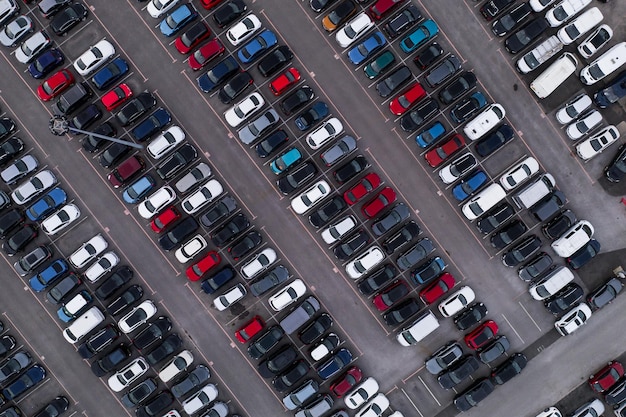 Photo aerial view looking down onto a garage forecourt with lots of new cars for sale