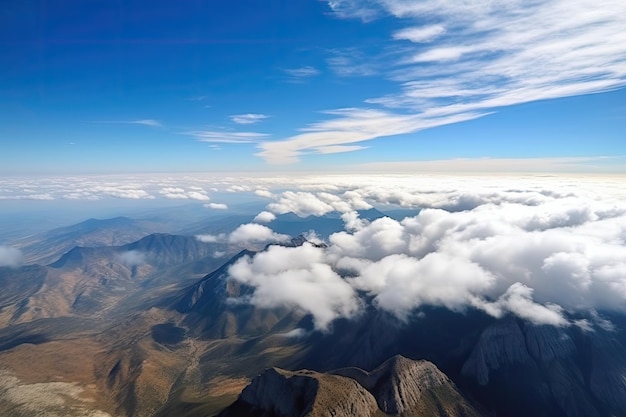 Aerial view of majestic mountain range with clouds and blue skies created with generative ai