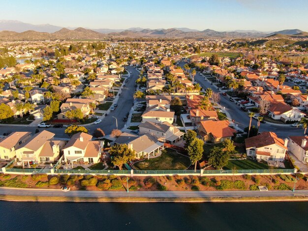 Aerial view of Menifee Lake and neighborhood residential subdivision during sunset Riverside USA