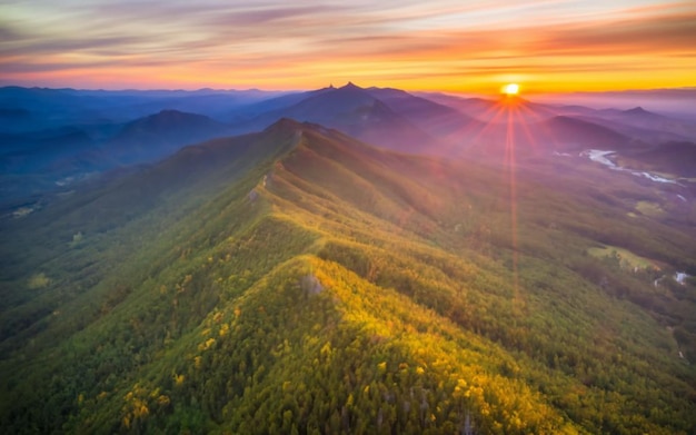 Aerial view of misty mountains at sunrise