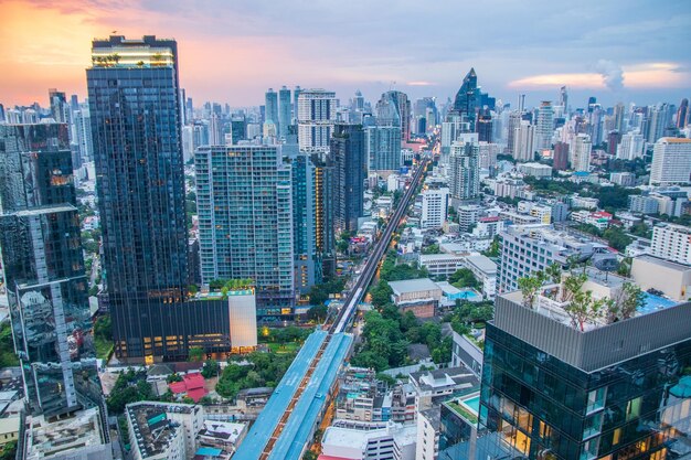 Aerial view of modern buildings in city against sky