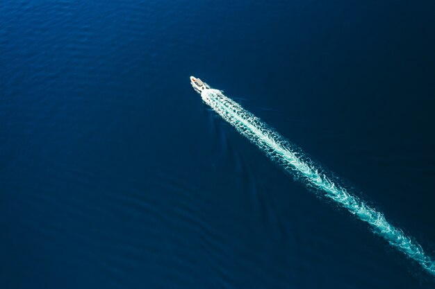 Aerial view of motor boat sailing in the sea amazing seascape with the fishing boat