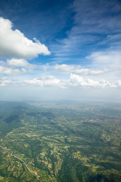 Aerial view of mountains landscape. Blue sky with tiny clouds