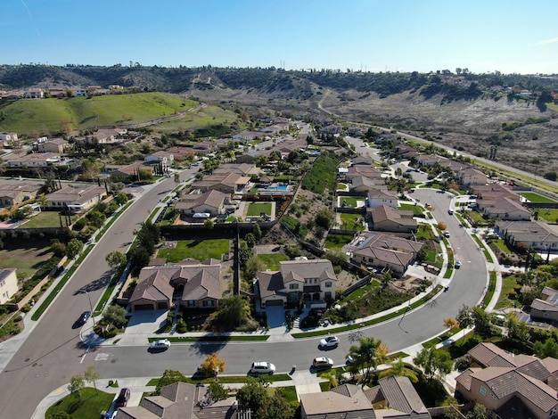 Aerial view of neighborhood with residential subdivision houses and small road in Chula Vista