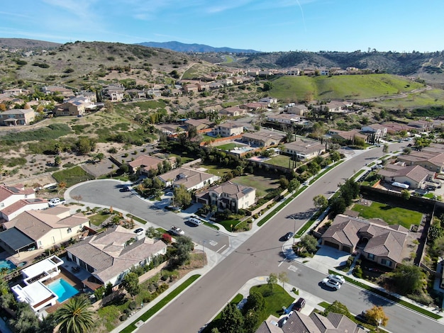 Aerial view of neighborhood with residential subdivision houses and small road in Chula Vista