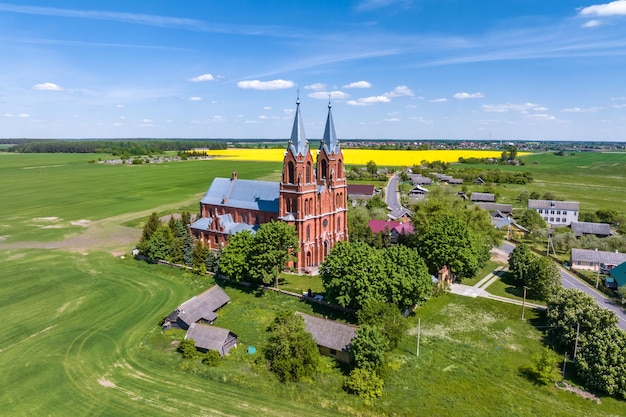 Aerial view on neo gothic temple or catholic church in countryside