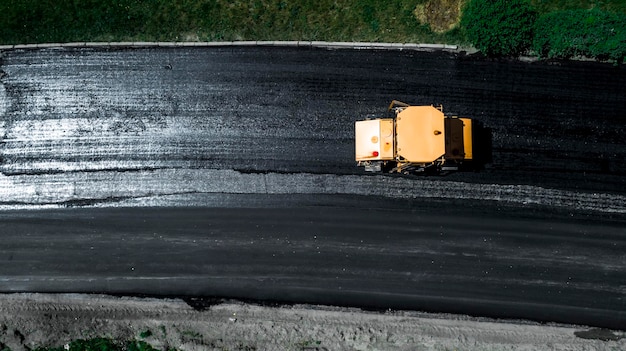 Aerial view on the new asphalt road under construction