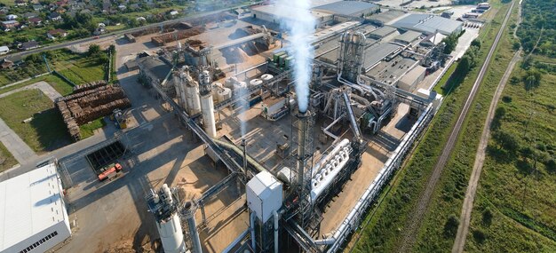 Photo aerial view of oil and gas refining petrochemical factory with tall refinery plant manufacture structure