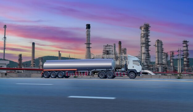 The aerial view of oil refinery factory and oil storage tank industry plant power at twilight and night sky background