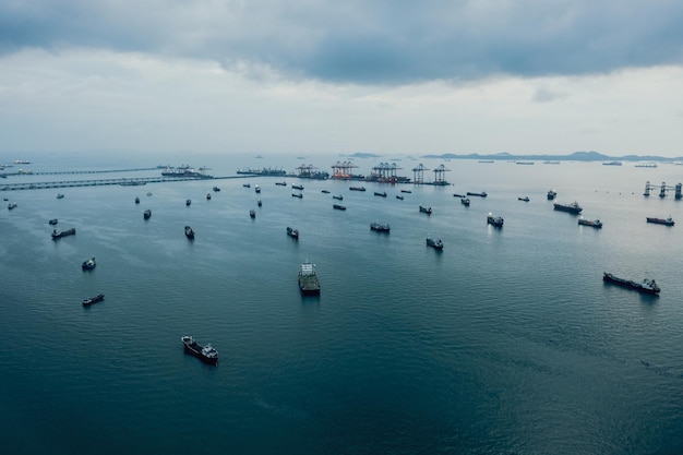 Aerial view Oil ship tanker parking in sea and cloud storm background