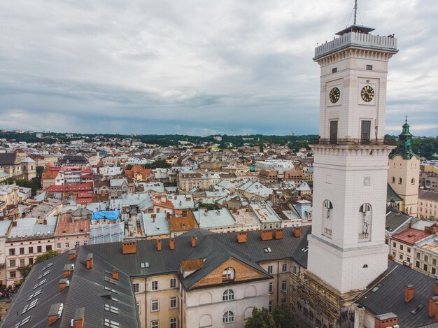 Aerial view old european city with red roofs. city hall tower. copy space