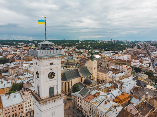 Aerial view old european city with red roofs city hall tower copy space