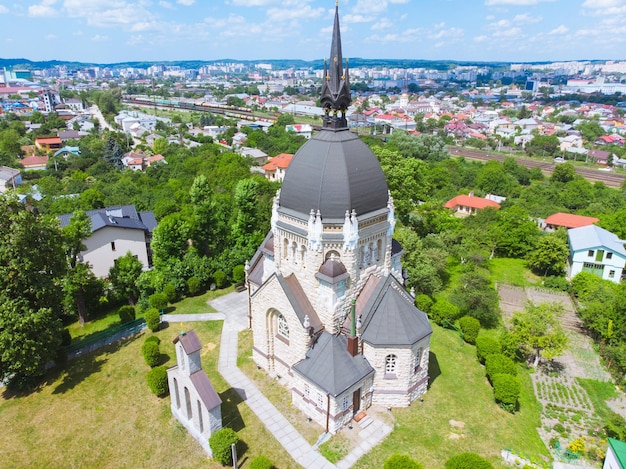 Aerial view of old gothic church city on background