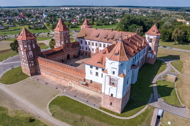 aerial view on overlooking restoration of the historic castle or palace near lake