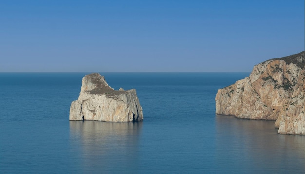 Aerial view of the Pan di Zucchero rock and the Porto Flavia mine on the west coast of Sardinia