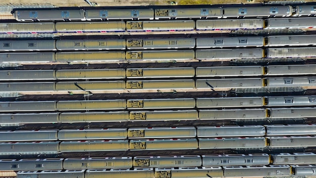 Aerial view over passenger trains in rows at a station