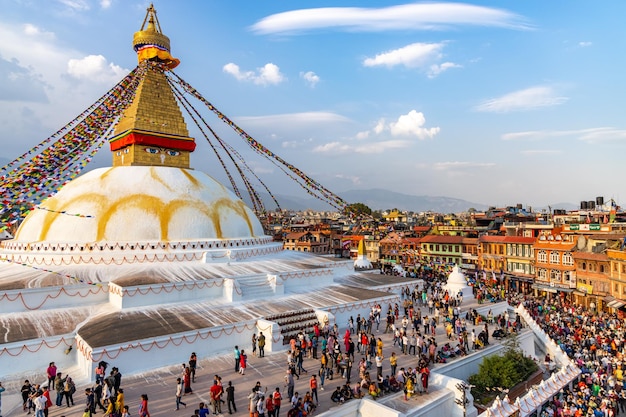 Aerial view of people standing by temple against sky