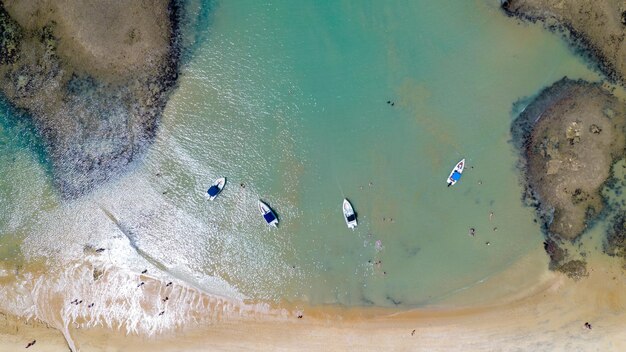 Aerial view of Praia do Espelho Porto Seguro Bahia Brazil Natural pools in the sea cliffs and greenish water