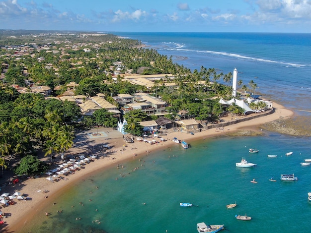 Aerial view of Praia Do Forte coastline village with beach and blue clear sea water Bahia Brazil