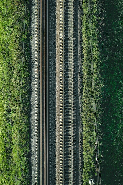 Aerial view of railway railroad tracks through countryside