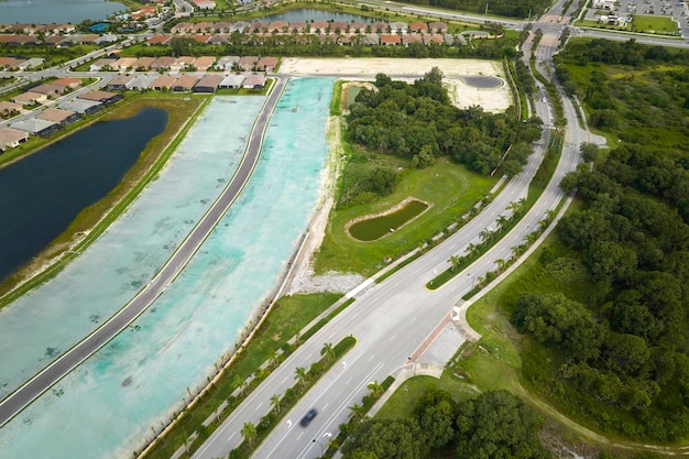 Aerial view of real estate development with tightly located family houses under construction in Florida closed suburban area Concept of growing american suburbs