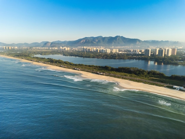 Aerial view of Reserva beach Marapendi lagoon and car traffic on Lucio Costa avenue Barra da Tijuca and Recreio in Rio de Janeiro Brazil Sunrise Sunny day Drone photo Praia da Reserva