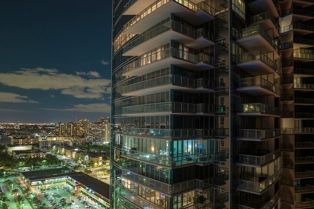 Aerial view of residential highrise skyscraper at night in Sunny Isles Beach city in Florida USA Housing development in modern american urban area