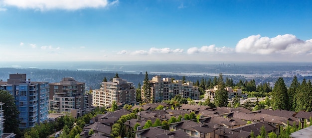 Photo aerial view of residential homes and buildings on top of burnaby mountain