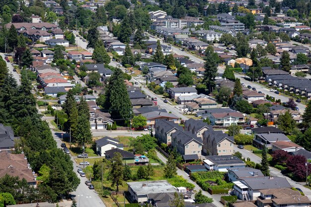 Aerial view of a residential homes in the suburbs during a sunny summer day