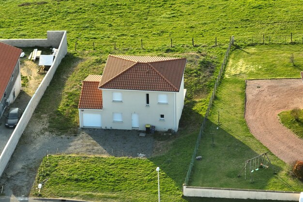 Aerial view of residential houses in green suburban rural area