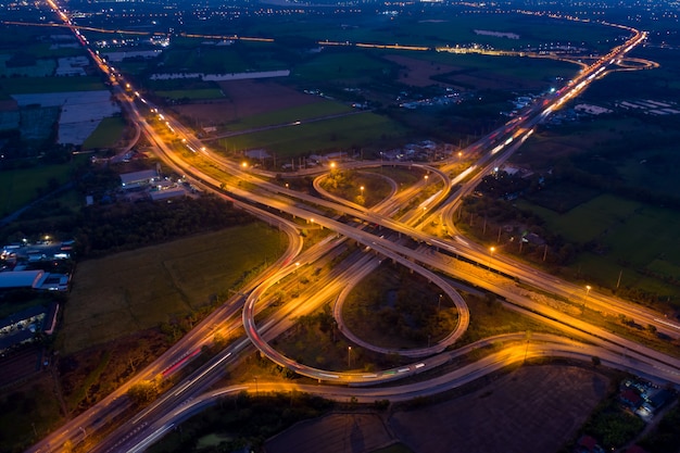 Aerial view ring road and interchange connecting the city at night