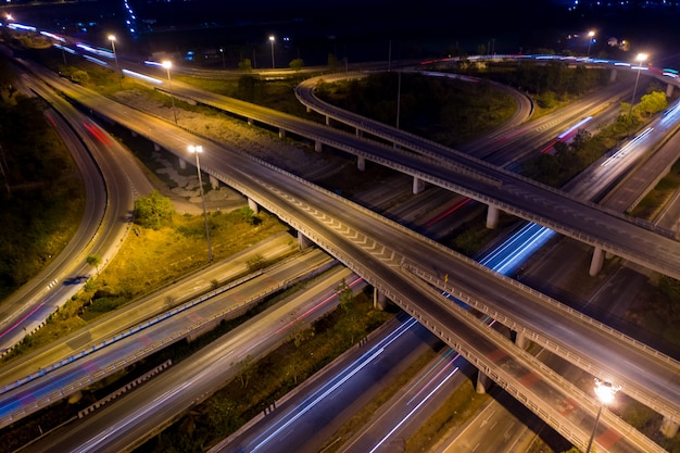 Aerial view ring road and interchange connecting the city at night