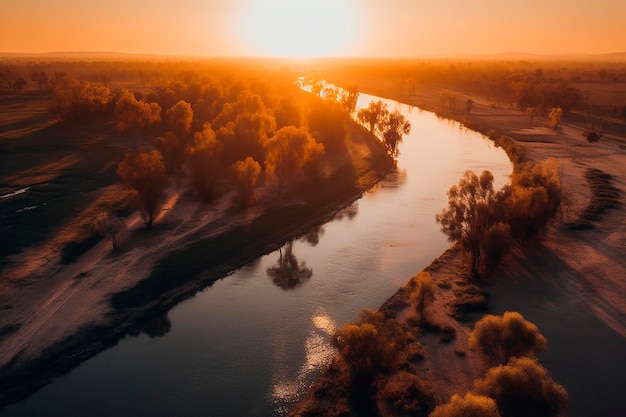 Aerial view of a river with trees and the sun setting