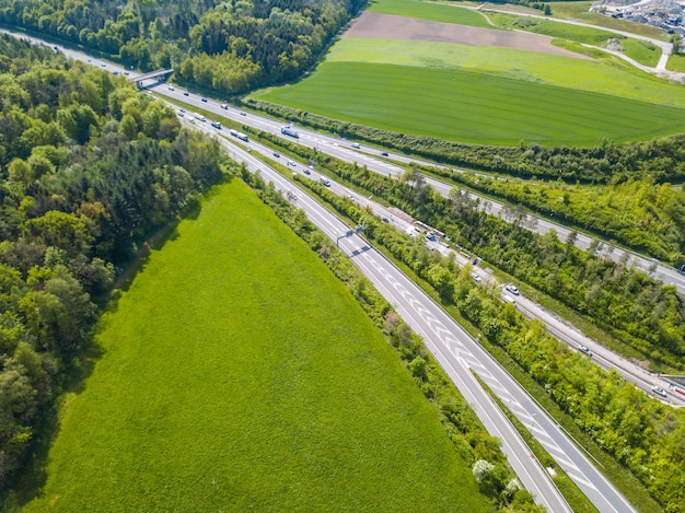 Aerial view of road amidst green landscape