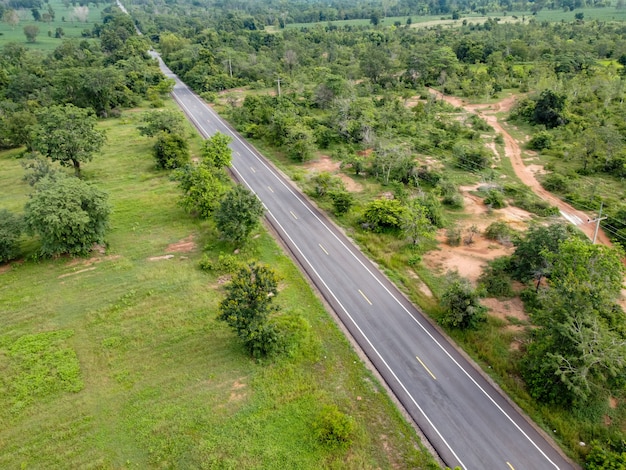 Aerial view road going through forest